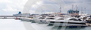 Speed boats at harbor. Power boats moored in marina. Sea coast pier