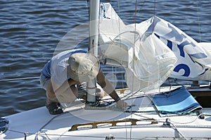 Yachtsman setting sail of a yacht before race