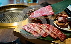 Yakiniku Japanese bbq with raw beef meat dish on the side