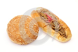 Yakisoba on a Hotdog bun and curry bread in a white background