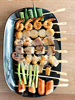 Yakitori: Japanese bite-sized food skewers: asparagus, sausage, scallop, squid, mushroom, prawns, chicken, pork, beef and okra
