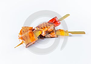 Yakitori Salmon Skewers with bell pepper served with sauce isolated on white background