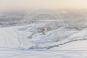 Yakutsk city in the fog on a cold winter evening.