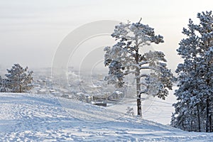 Yakutsk city in the fog on a cold winter evening.