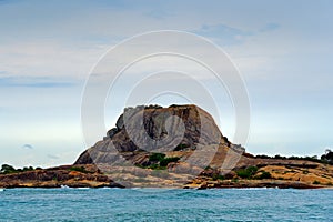 Yala National Park, Sri Lanka, Asia. Beautiful landscape, lake with water and stone hill. Ocean in Sri Lanka, Big stone rock in th photo