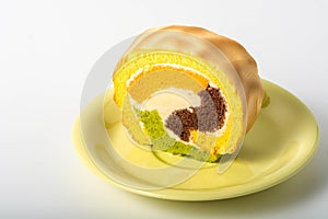 Yam roll cake on green plate