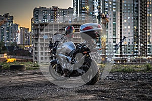 Yamaha FZS600 Fazer motorcycle parked in front of construction site in city