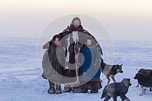 Yamalo-Nenets Autonomous Okrug, extreme north, Nenets family in the national winter clothes of the northern inhabitants of the