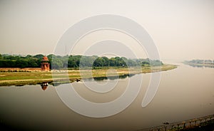 Yamuna river and a man in boat. View from Taj photo