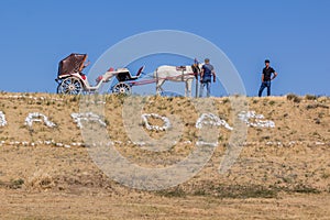 YANAR DAG, AZERBAIJAN - JUNE 19, 2018: Horse carriage at Yanar Dag, burning mountain, continuous natural gas fire in