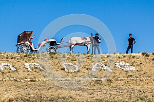 YANAR DAG, AZERBAIJAN - JUNE 19, 2018: Horse carriage at Yanar Dag, burning mountain, continuous natural gas fire in