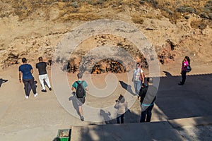 YANAR DAG, AZERBAIJAN - JUNE 19, 2018: Tourists observe Yanar Dag, burning mountain, continuous natural gas fire in