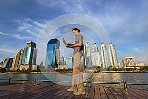 Yang man using a laptop computer