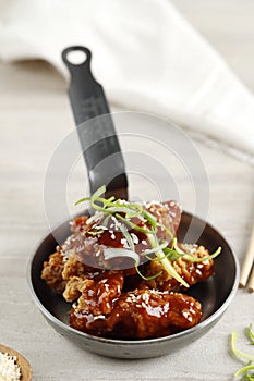 Yangnyeom Chicken, Korean Style Swet and Sour Chicken with Sesame Seed on Top