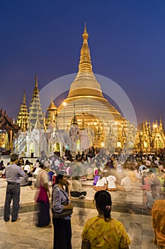 YANGON, MYANMAR, December 25, 2017: Shwedagon Pagoda with believers