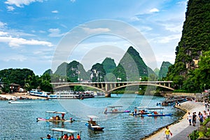 Yangshuo, China - July 27, 2018: Tourist bamboo rafts on Li river in Yangshuo near Guilin in China