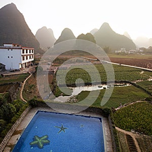 Yangshuo, China  - November 7, 2019: Sunrise over the countryside in Yangshuo, Guanxi province