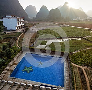 Yangshuo, China  - November 7, 2019: Sunrise over the countryside in Yangshuo, Guanxi province