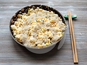 Yangzhou fried rice in ceramic plate on wood table