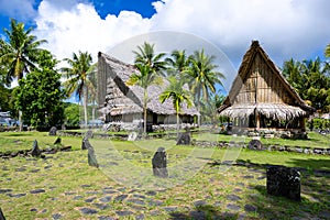 Yap Island, Yapese thatched old traditional meeting houses with money bank in front, Micronesia.