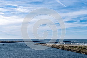 The Yaquina Bay jetty extends into the Pacific Ocean at Newport, Oregon, USA