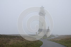 Yaquina Head Lighthouse in the fog. Oregon United States of America.