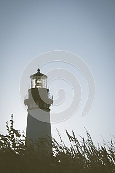 Yaquina Head Lighthouse in Newport Oregon, along the Pacific Ocean photo