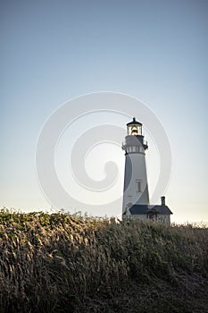 Yaquina Head Lighthouse in Newport Oregon, along the Pacific Ocean photo