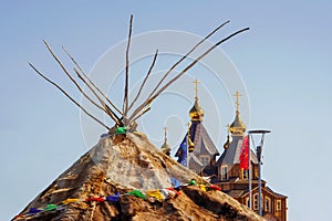 Yaranga (traditional home of the Chukchi - the indigenous people of Chukotka) against the background of the Christian Orthodox Cat