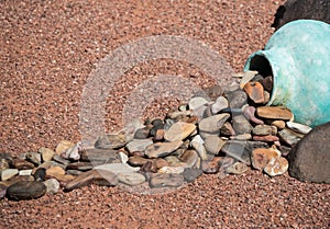 Yard art, rocks spilling from pottery