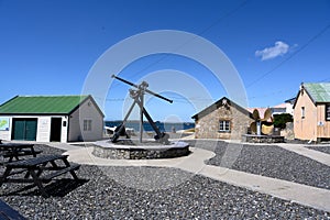 Historic Dockyard Museum of Port Stanley, Capital City of Falkland Islands or Las Malvinas. Yard with anchor and screw propeller