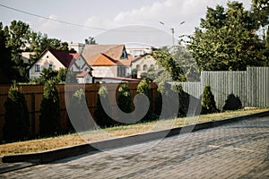 yard with lawn sprinkler spaying water over green grass. photo