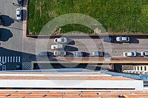 Yard with parking for cars and green grass, top view