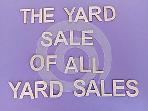 The yard sale of all yard sales sign on a purple background