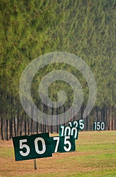 Yard signs in driving range