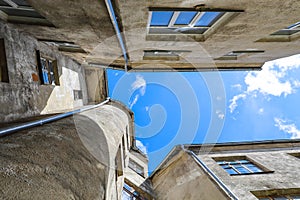 Yard well, against the blue sky. Historical buildings