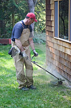 Yard work trimming weed eater