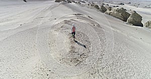 Yardang landform landscapewoman trail runner cross country running