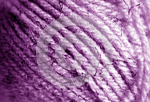 Yarn ball close-up with blur effect in purple color