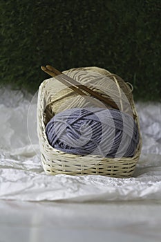 Yarn ball and Crochet Hook put in woven basket