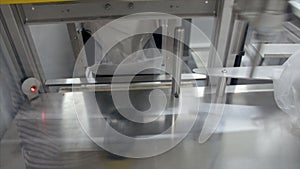 Yarn creel spools getting packed in an automatic machine in textile factory