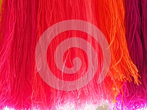 Yarn, Garn several colors arranged abstract Gradient for background, colorful pink orange red blue purple violet gold o-rose dark