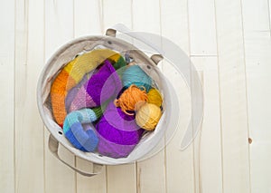 Yarn for knitting rainbow. Wood background