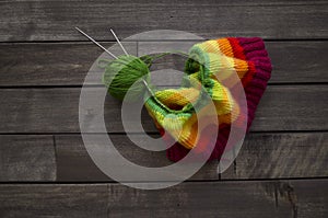 Yarn for knitting rainbow. Wood background