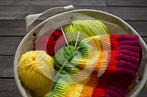 Yarn for knitting rainbow. Wood background