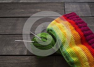 Yarn for knitting rainbow. Wood background