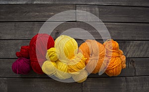 Yarn for knitting rainbow. Wood background