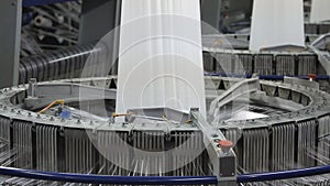 Yarn spools on spinning machine in a factory