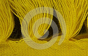 Yarn Tassels on a Yellow Placemat