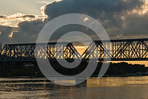 Yaroslavl, Russia, July 8, 2023. Railway bridge over the river at sunset.